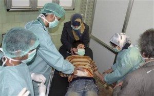 A young boy is treated in an Aleppo hospital after what the Syrian government claims was a chemical weapons attack. Picture: REUTERS/George Ourfalian 