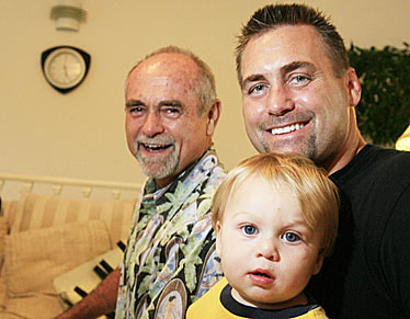 Three generations of Stonebrakers -- Pastor William "Bill" Stonebraker Jr. of Calvary Chapel of Honolulu; his son, Pastor William "Bud" Stonebraker III of South Shore Christian Fellowship, and William "The Dude" Stonebraker IV -- are shown in their Hawaii Kai home.