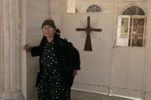 in-this-file-photo-an-iraqi-christian-woman-leaves-a-church-in-tal